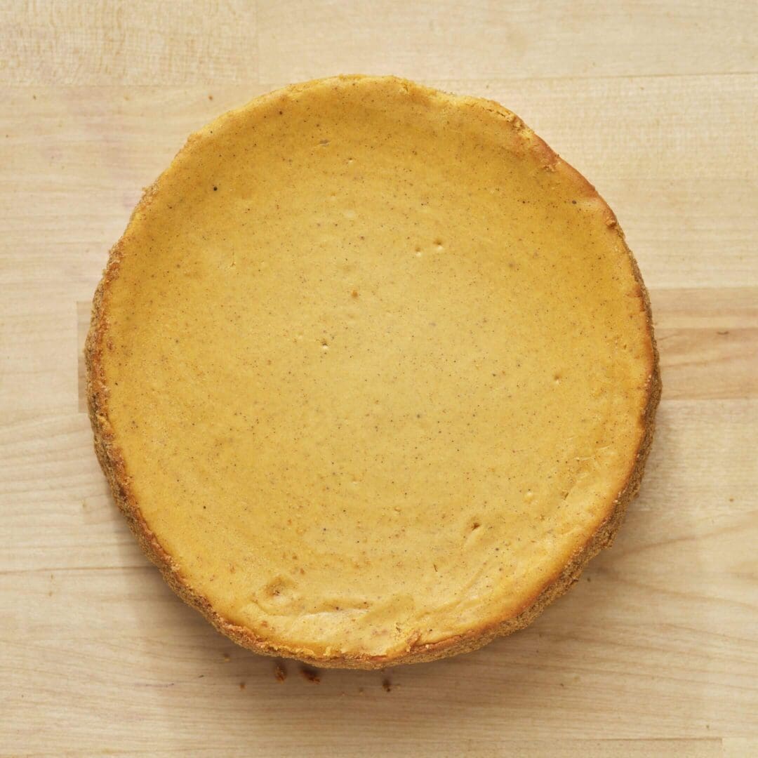 Pumpkin pie on a wooden table.